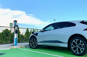 Electric vehicle at new EV charging station