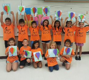 Camp Boca campers holding up their artwork