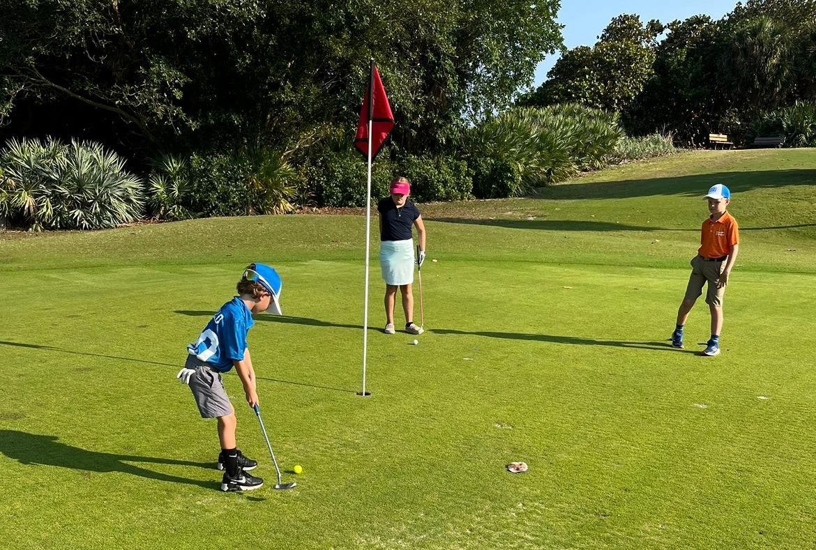 Young golfers practicing.