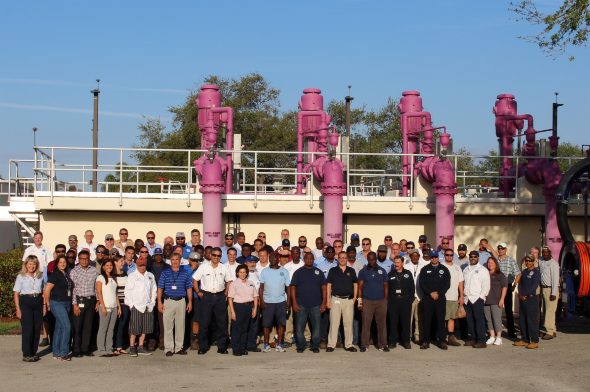 City of Boca Raton Utility Services staff photo in front of reclaimed water pipes
