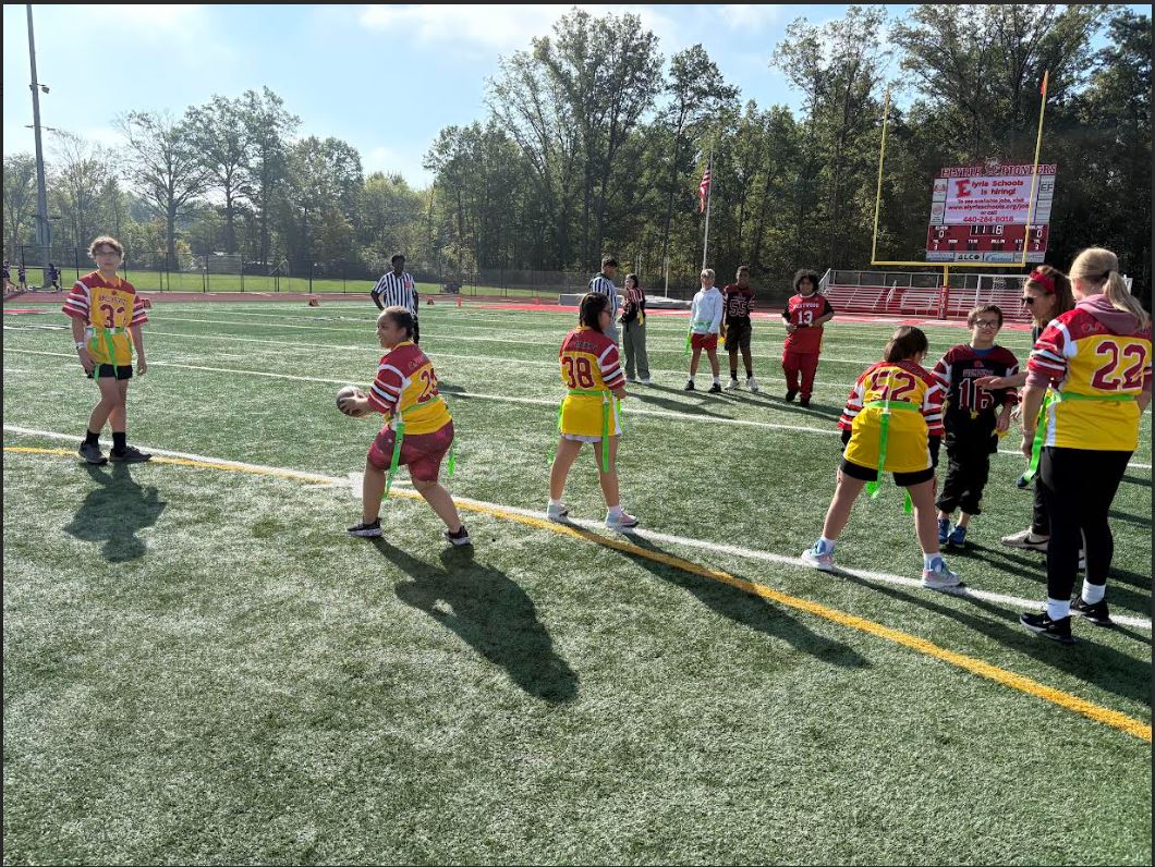BBHMS Unified Sports participants tosses football to teammate