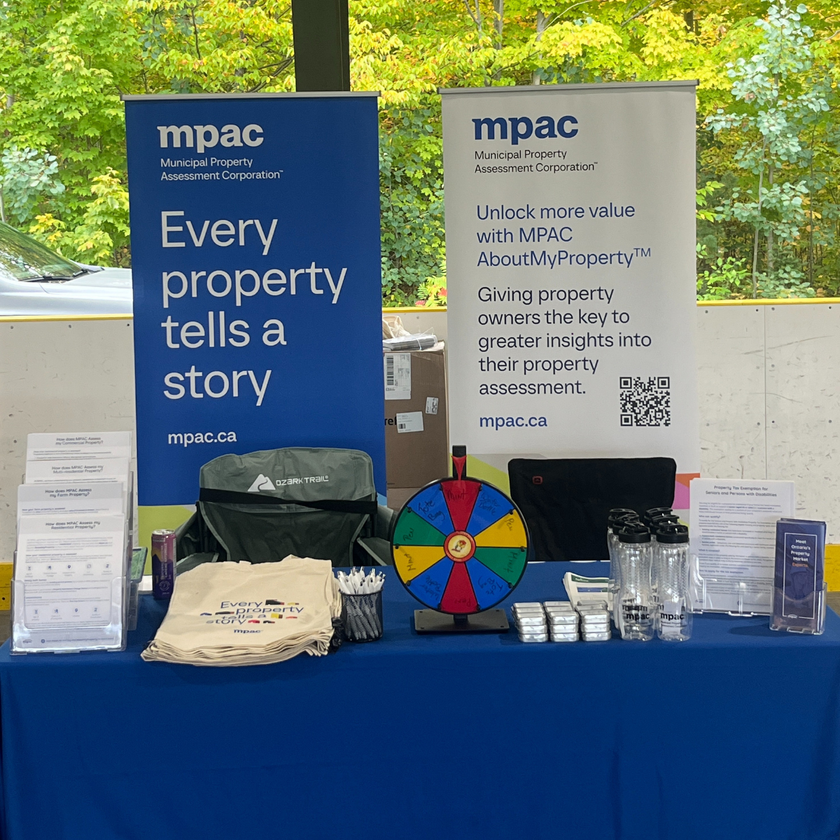 A photo of the MPAC exhibitor booth with educational materials and giveaways at a community event