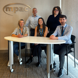 photograph of Megan Ramsay Greg Martino Keira Gaunt Cathy Ranieri-Sweenie and Adam Hall sitting in a boardroom in front of the MPAC logo