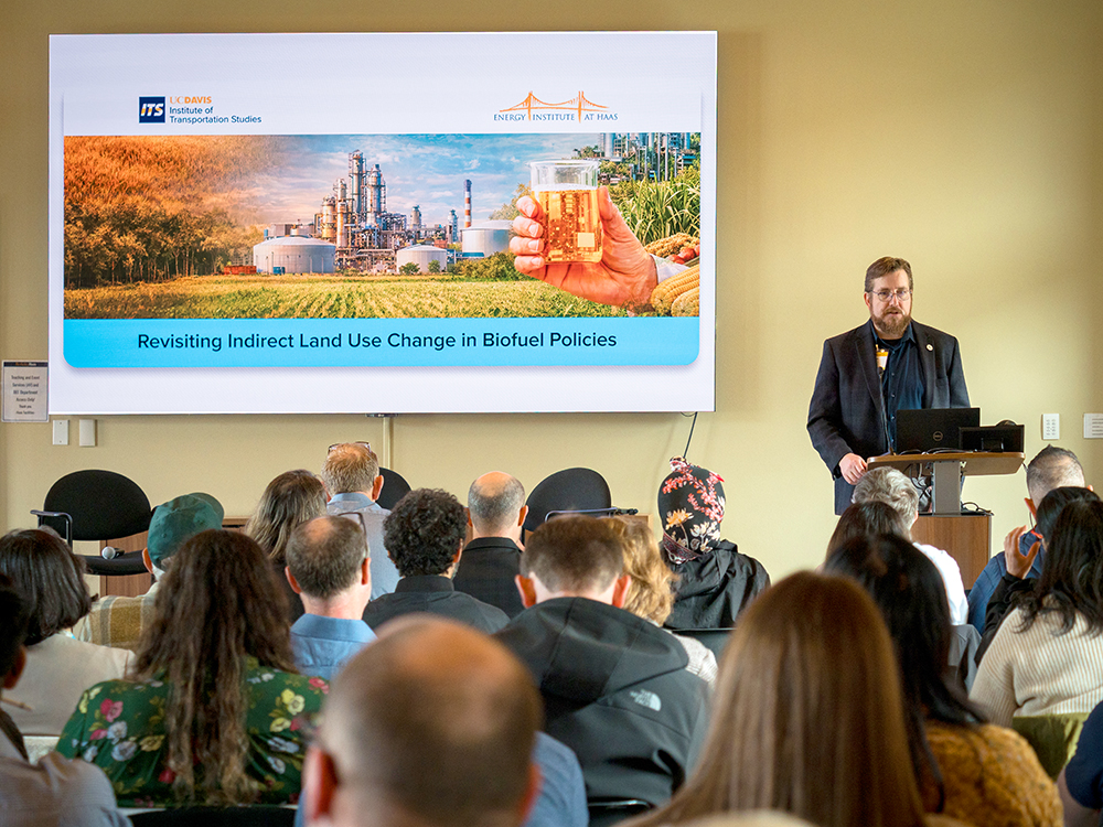 Group of attendees watch Colin Murphy's opening remarks at the Indirect Land Use Workshop