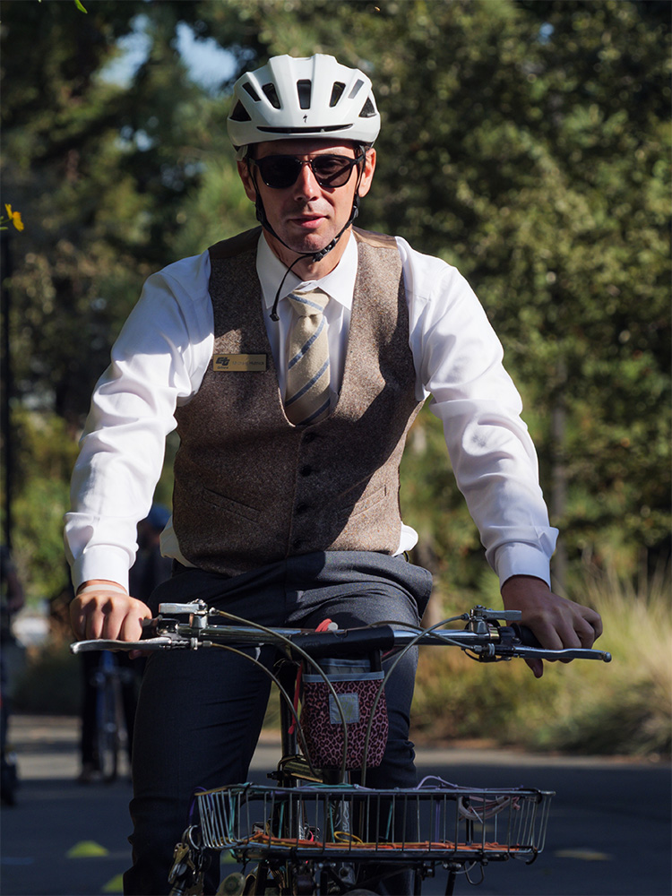 Man on bicycle with helmet.