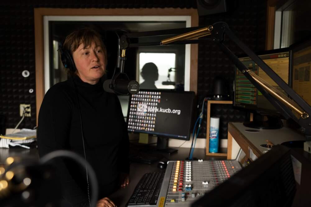 A woman in a radio studio