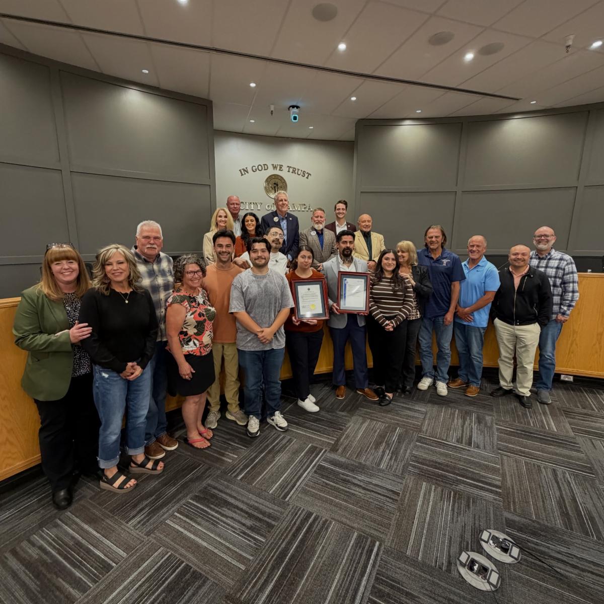 Group photo at city council of Luis Granados, recognized for his recent pardon