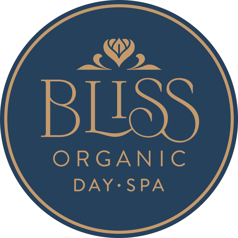 bliss organic day spa, gold font in blue circle