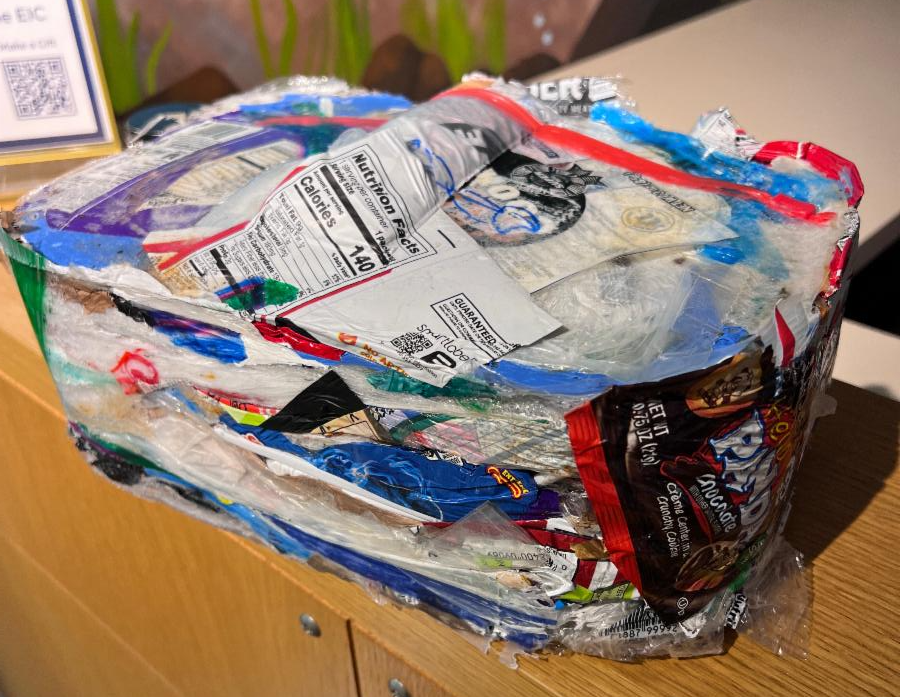 Compacted plastic trash in a recycled "brick."