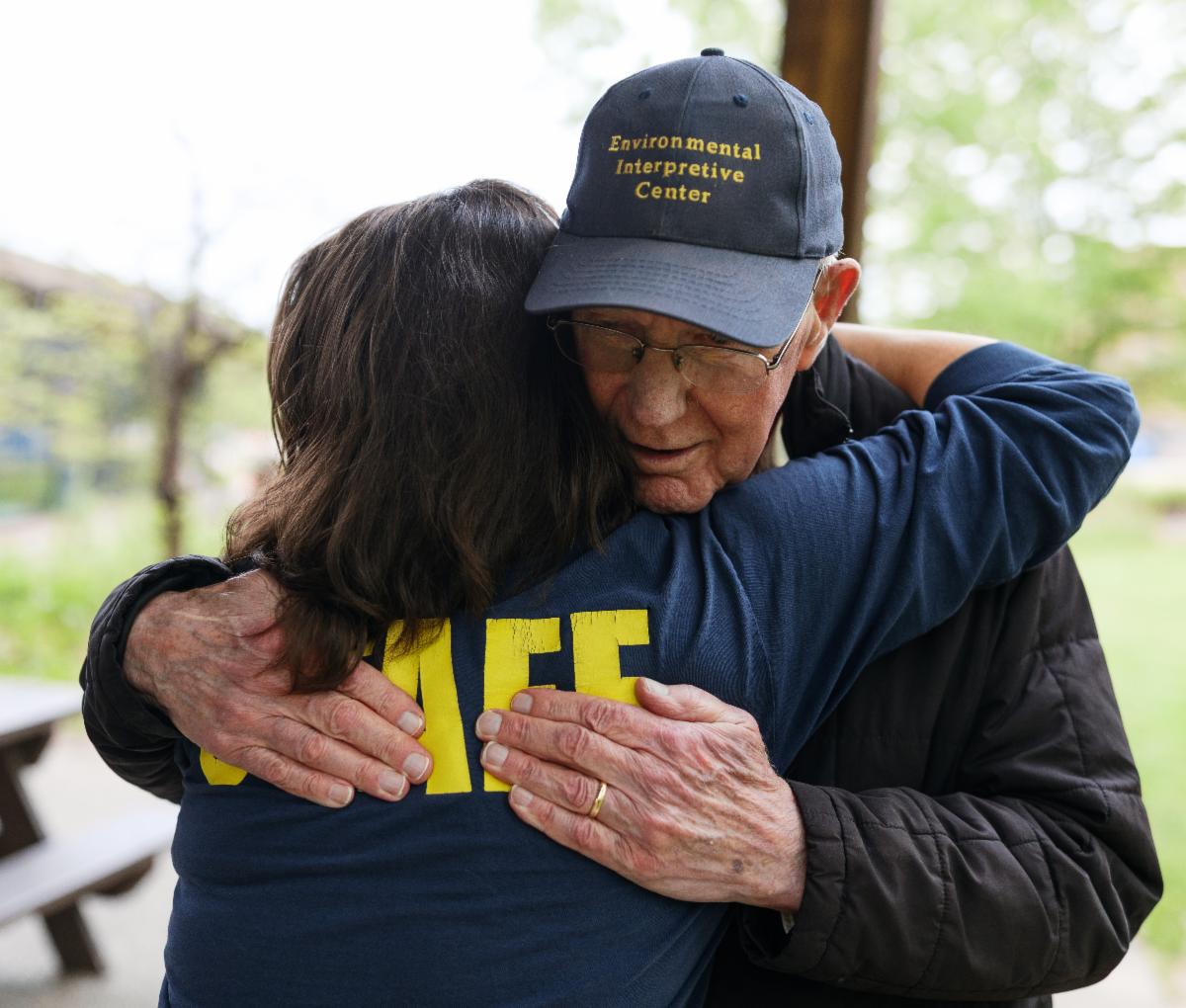 Dr. Gelderloos sharing a hug with alumna and EIC staff naturalist Dale Browne.