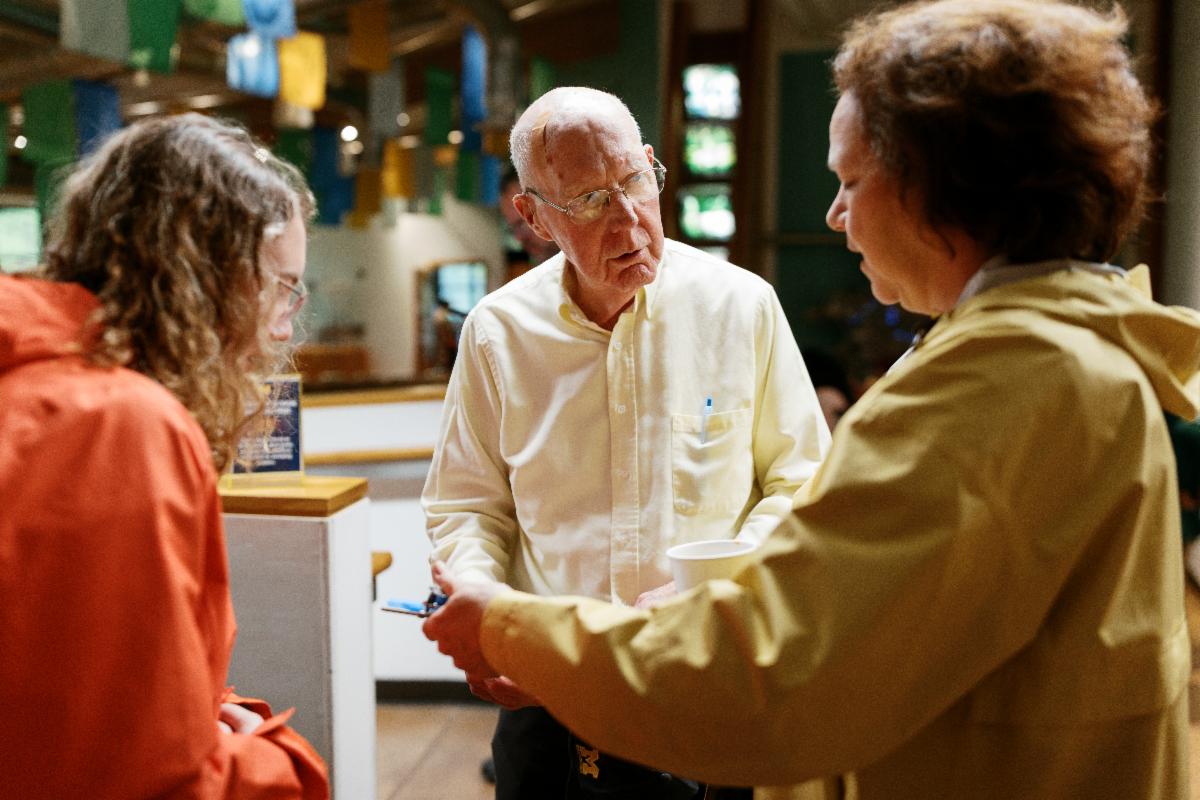 EIC founder and first director Dr. Orin Gelderloos, speaking with alumna Amy Haratyk  and her niece at the reception.