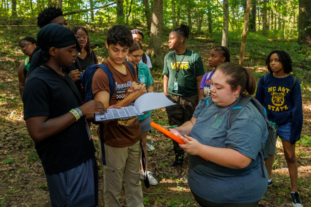 Kaitlynn Gootee collects data with students at the Environmental Education and Research Center.