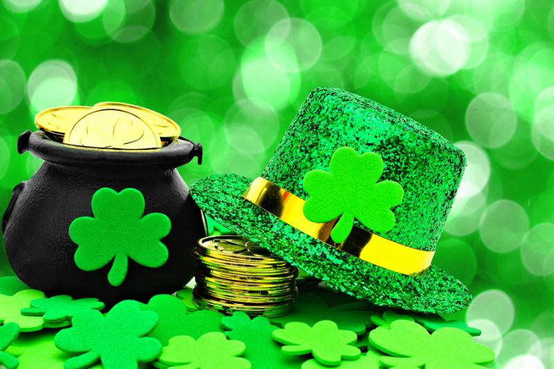 St Patricks Day Pot of Gold, hat and shamrocks over a green background