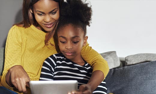 Mother and Daughter on Computer