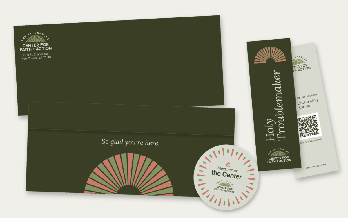 St. Charles Center welcome package: Meet me at the Center sticker, Holy Troublemaker bookmark, and custom mailer