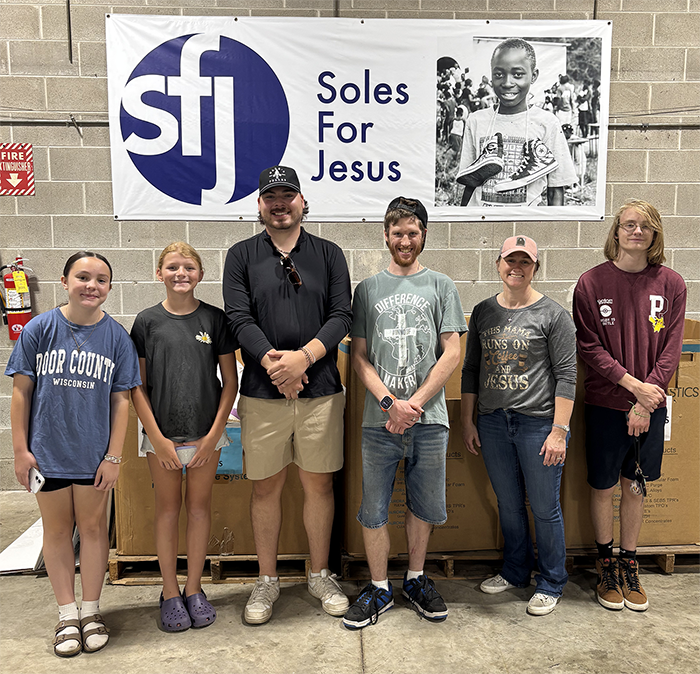 St Johns Youth helped sort and pack shoes at Soles for Jesus