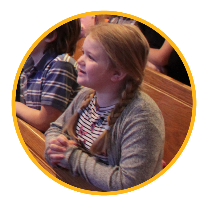 Girl Prays during chapel