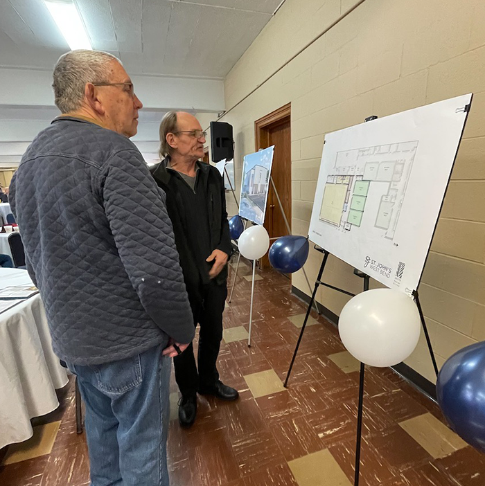 Church members view renderings of the school