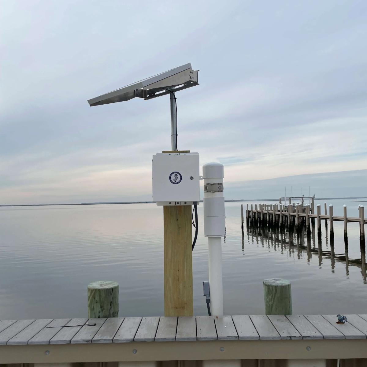 Equipment mounted to a pole on a bay waterfront 