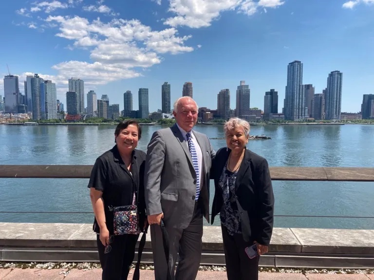 Tony MacDonald and colleagues standing on New York waterfront