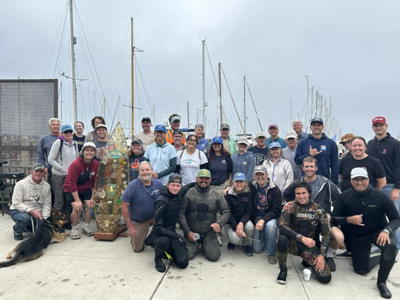 2026 Operation Clean Sweep Volunteer Group Photo in front of Marina 4.