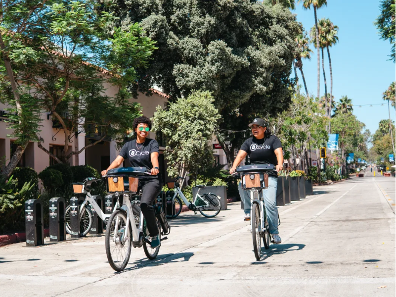people riding bcyles on state street.