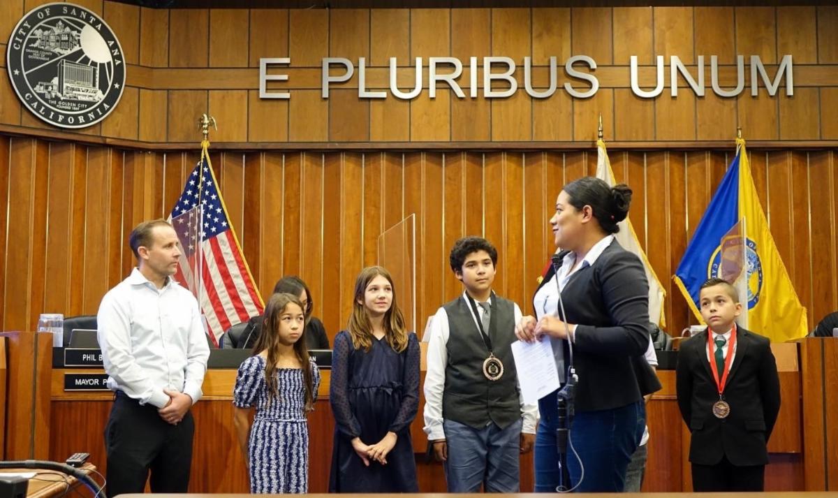 Councilmember Lopez and Speech and Debate Team inside Chambers