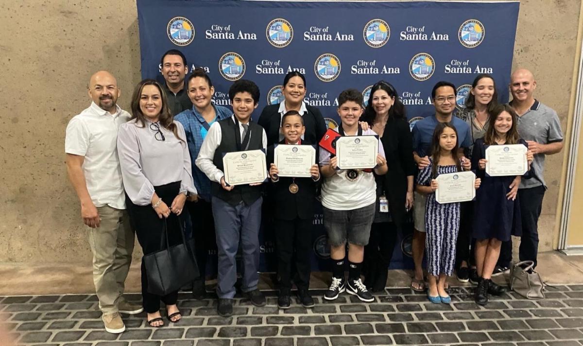 Councilmember Lopez and Speech and Debate Team outside with families