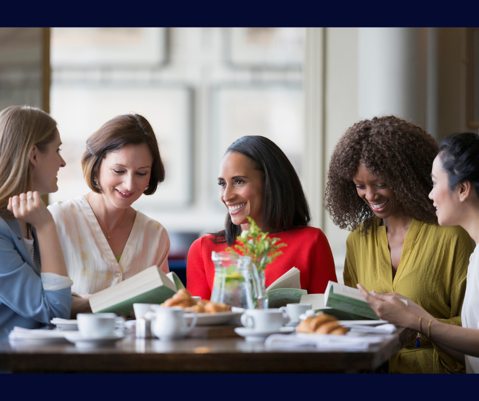 A group of five diverse ladies in a book club discussion 