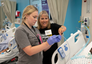 Image of Nursing student and professor in Stimulation lab