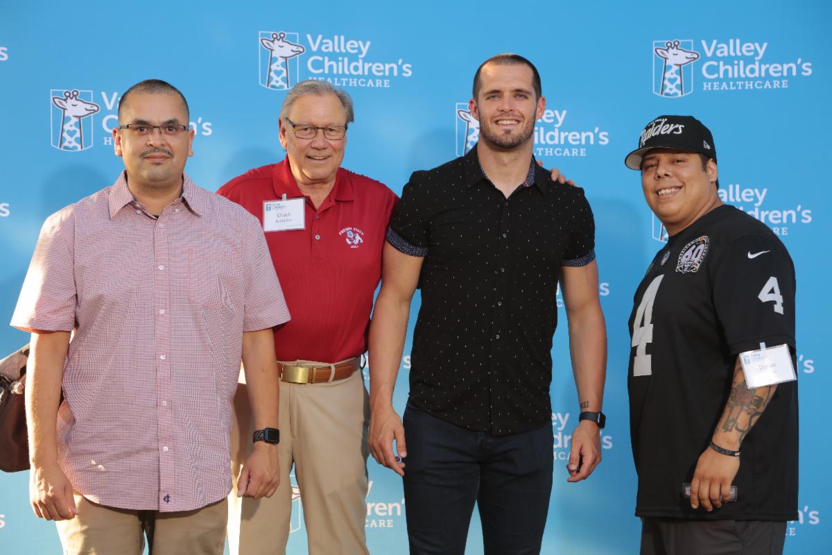 Derek Carr with DC4KIDS Members Outside