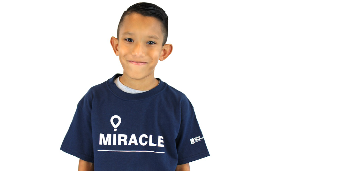 Tyson wearing a CMN Hospitals and Valley Children's Miracle Shirt