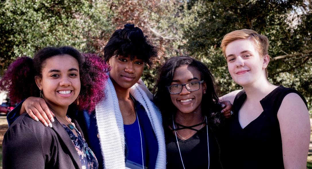 Group of female teens standing