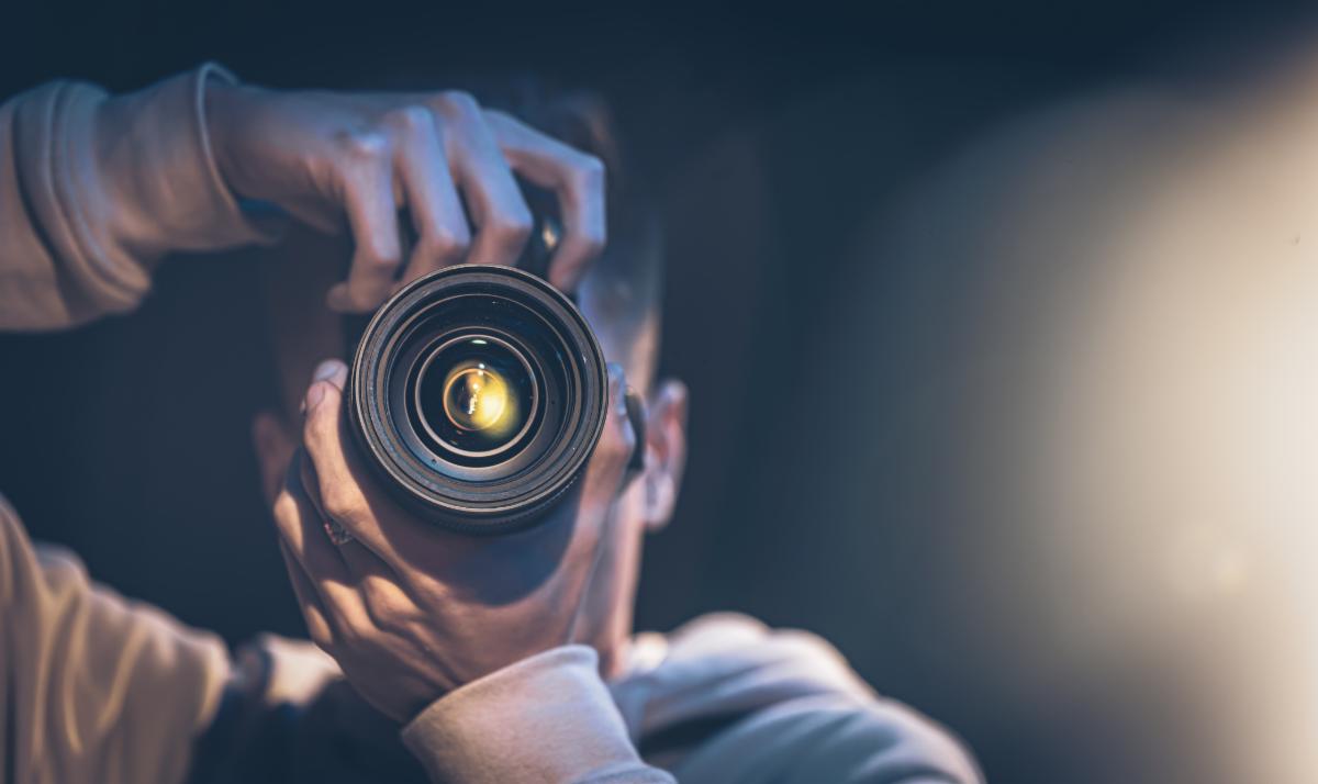 Photographer in dark background