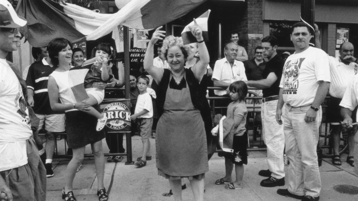 A crowd of people in an outdoor location celebrating.