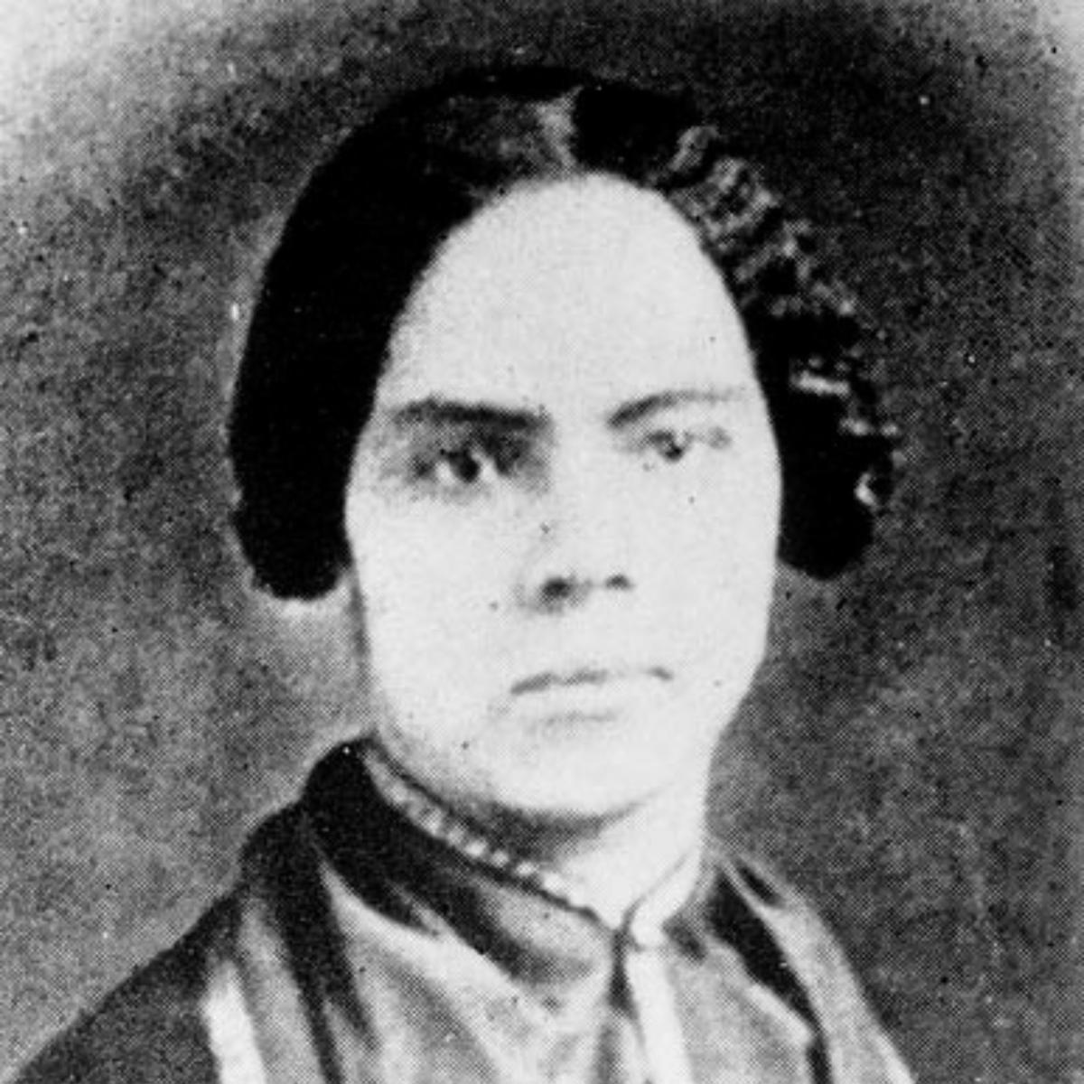 Black and white portrait photograph of a woman in 19th-century dress
