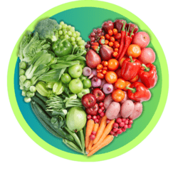 Colorful fruits and vegetables arranged in the shape of a heart