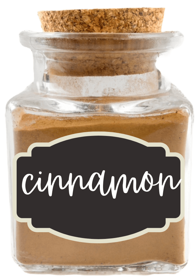 Small glass jar of brown spice, labeled "cinnamon"