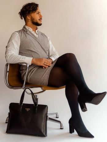 Nonbinary portrait of a man in a dress with high heels