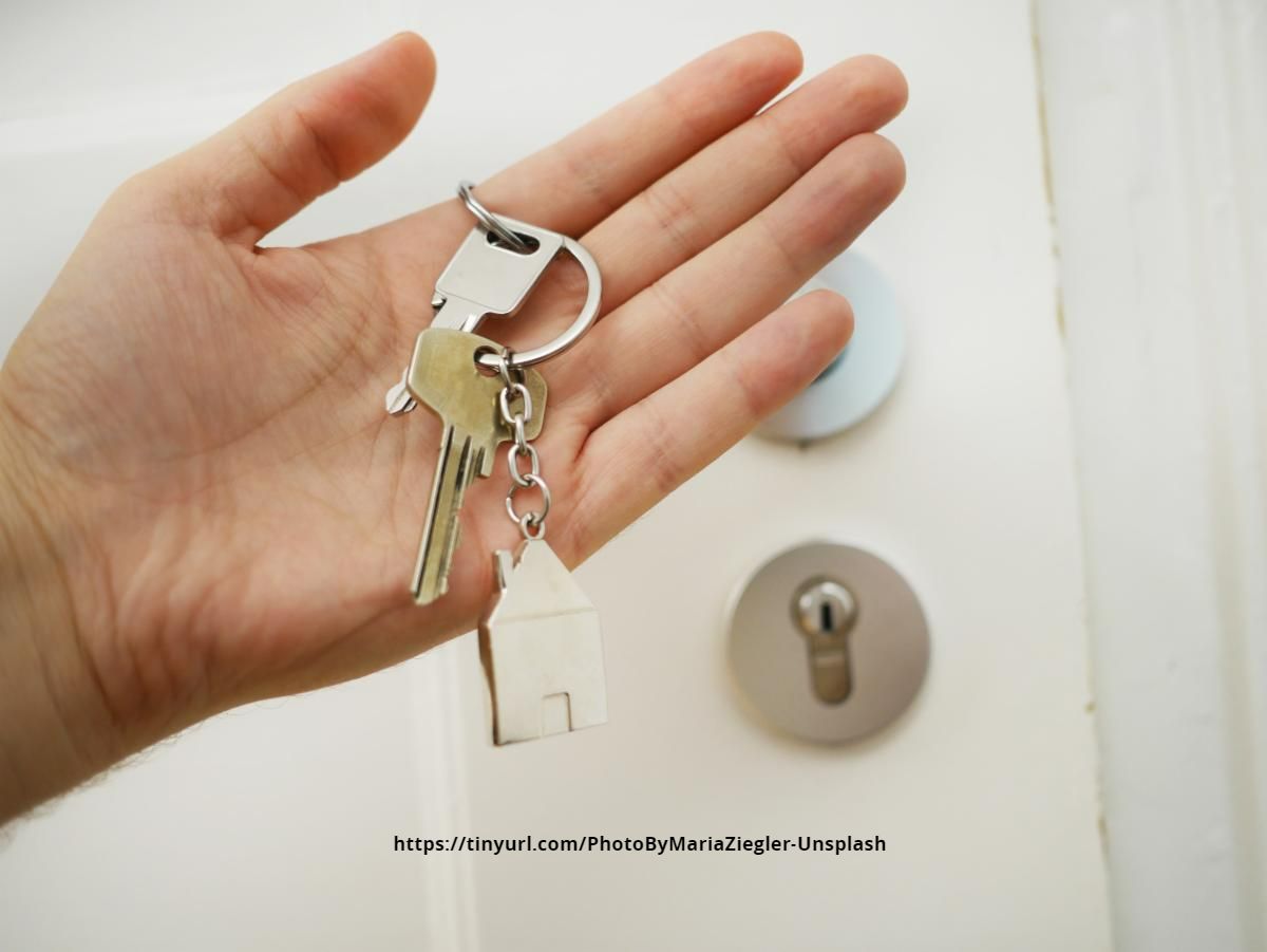 Hand Holding House Keys