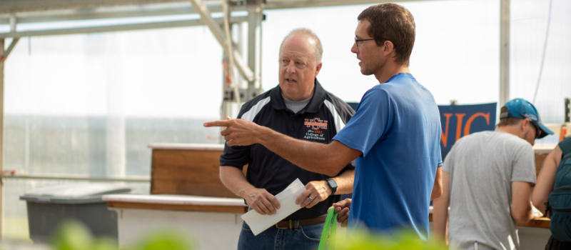 Chris Mullins speaking with farmer