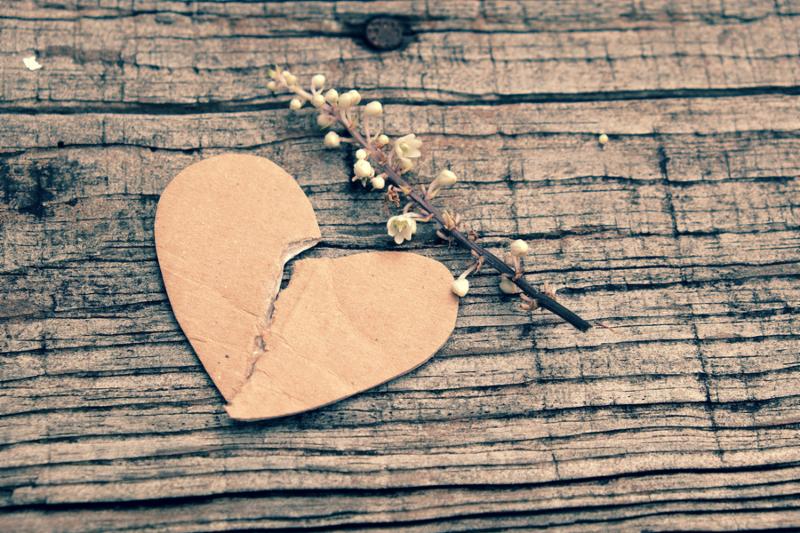 Divorce background with broken heart and message on wooden unhappy marriage and adultery problem make stress life society issue in modern lifestyle