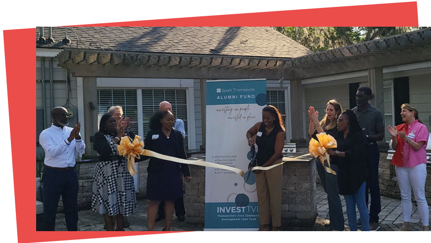 DeShay Williams of Spark Thomasville cuts the ribbon for the InvestTVL alumni fund