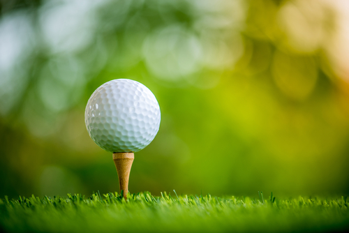 golf ball on tee ready to play