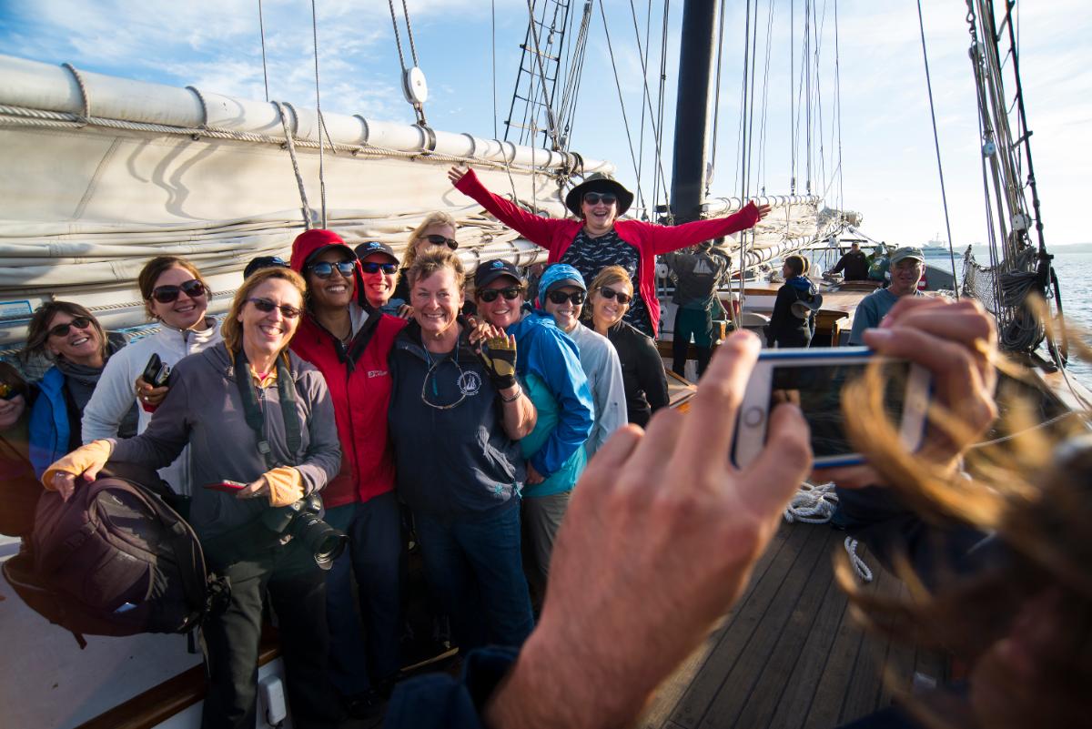 adults posing for group photo aboard schooner Californian