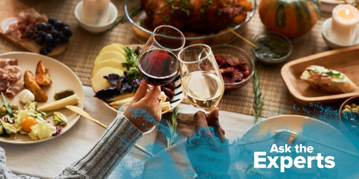 Couple toasts with glasses of wine.  Text says "Ask the Experts" 