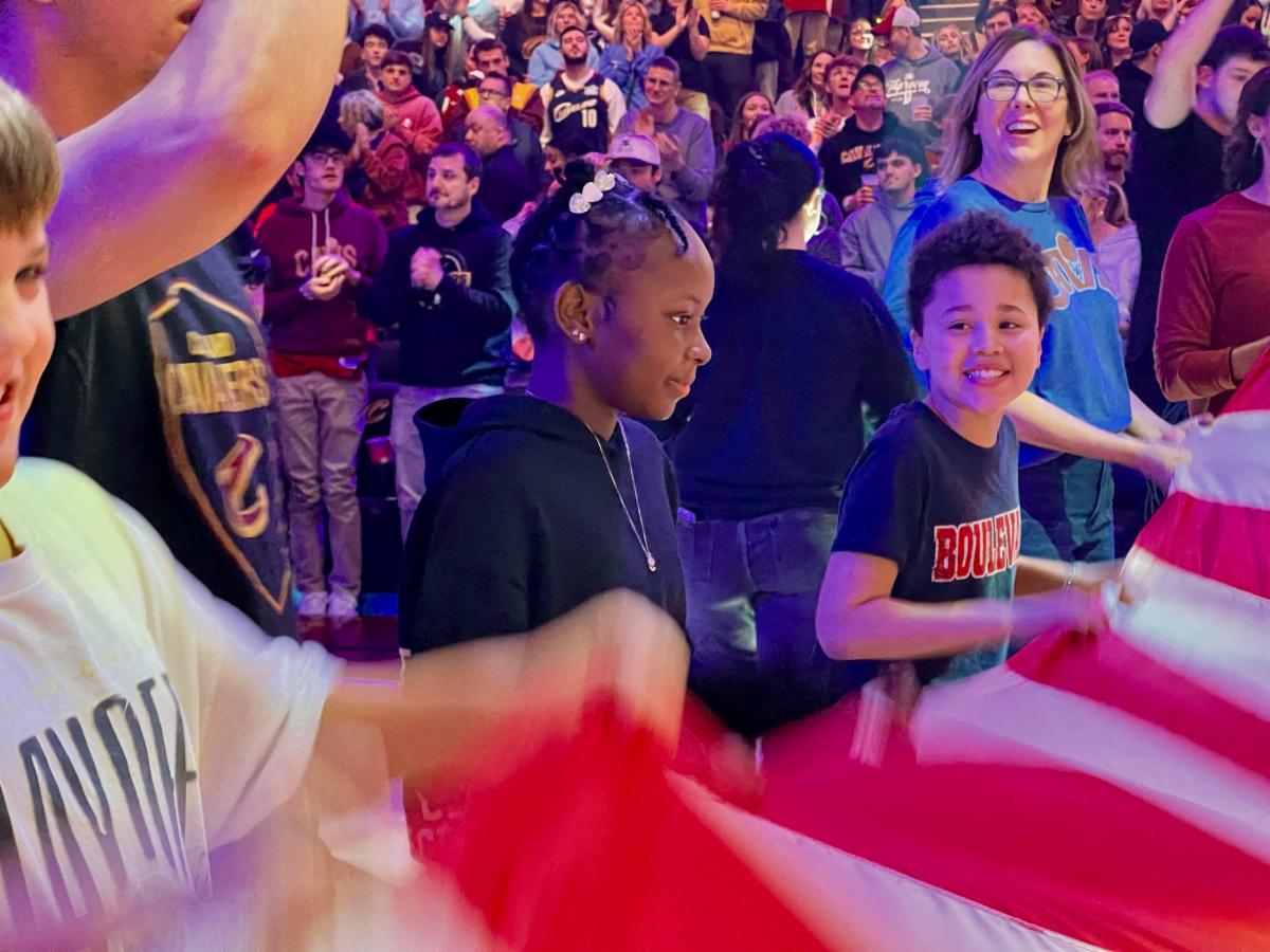 Elementary school students hold the flag at a recent Cleveland Cavaliers game.