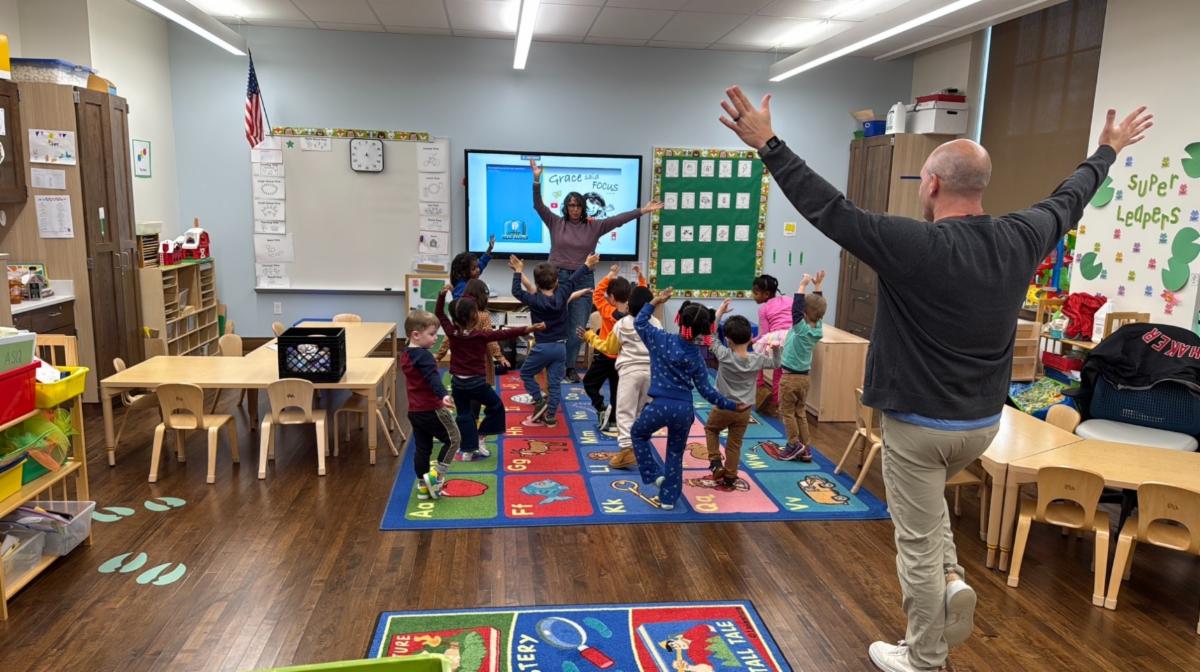 Ludlow students do yoga in a classroom.