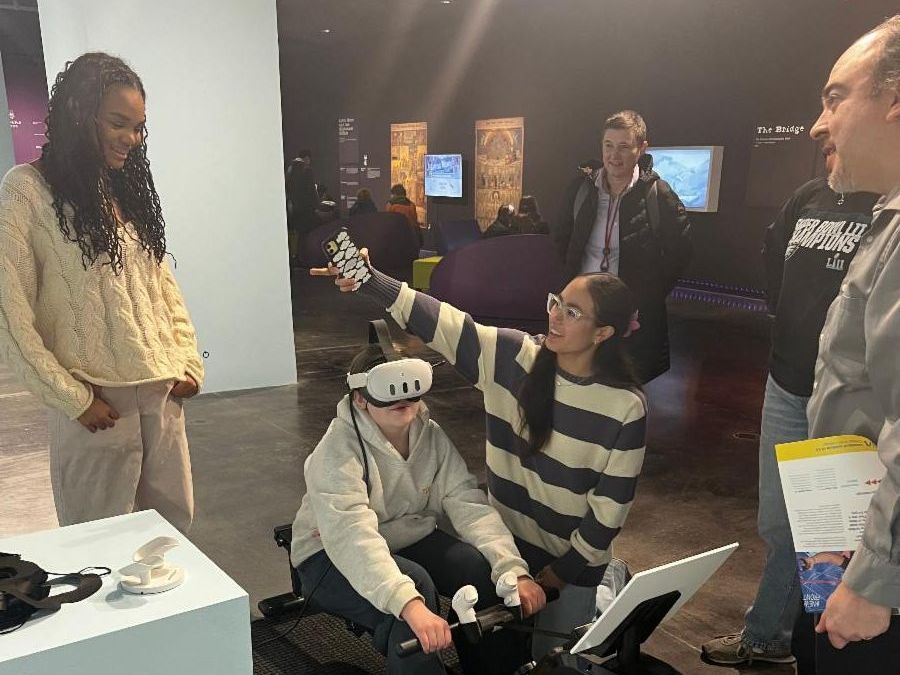 Students wear virtual reality glasses to play video games.