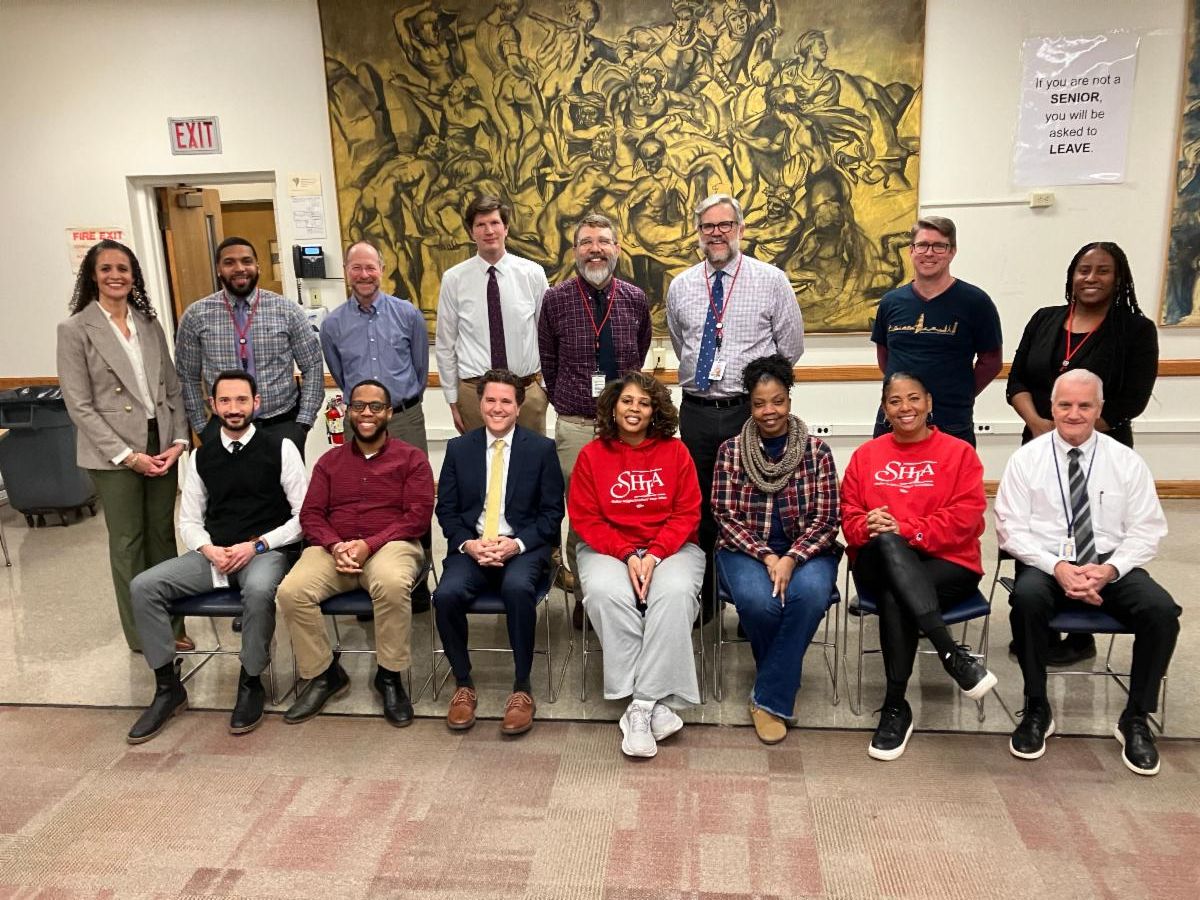 Administrators and Shaker Heights Teachers Association (SHTA) members pose for a photo following the ratification of a new contract.